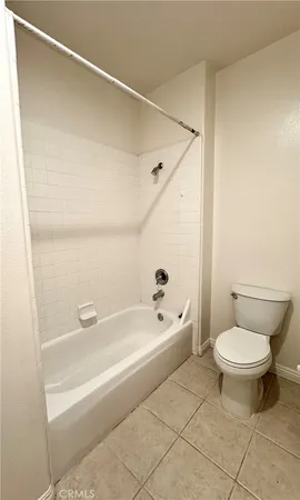 an aerial view of a house with a garden and swimming pool