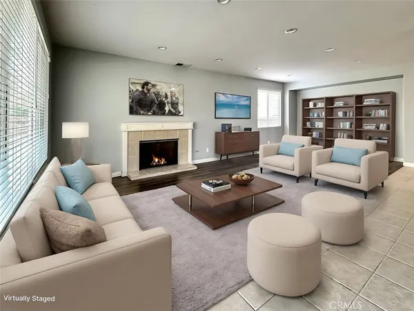 a view of a dining room and livingroom with furniture wooden floor and a rug