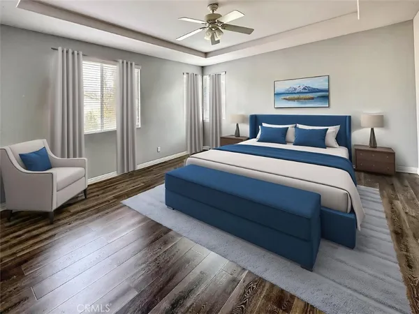 a bedroom with a bed and a painting on the wall