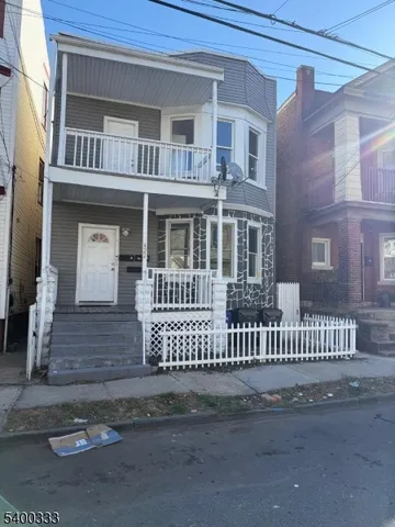 a front view of a house with a porch