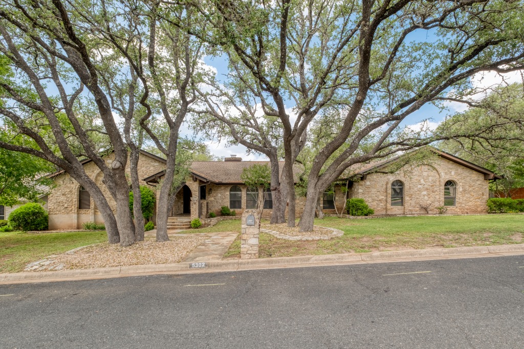 The property features a stone exterior and arched windows