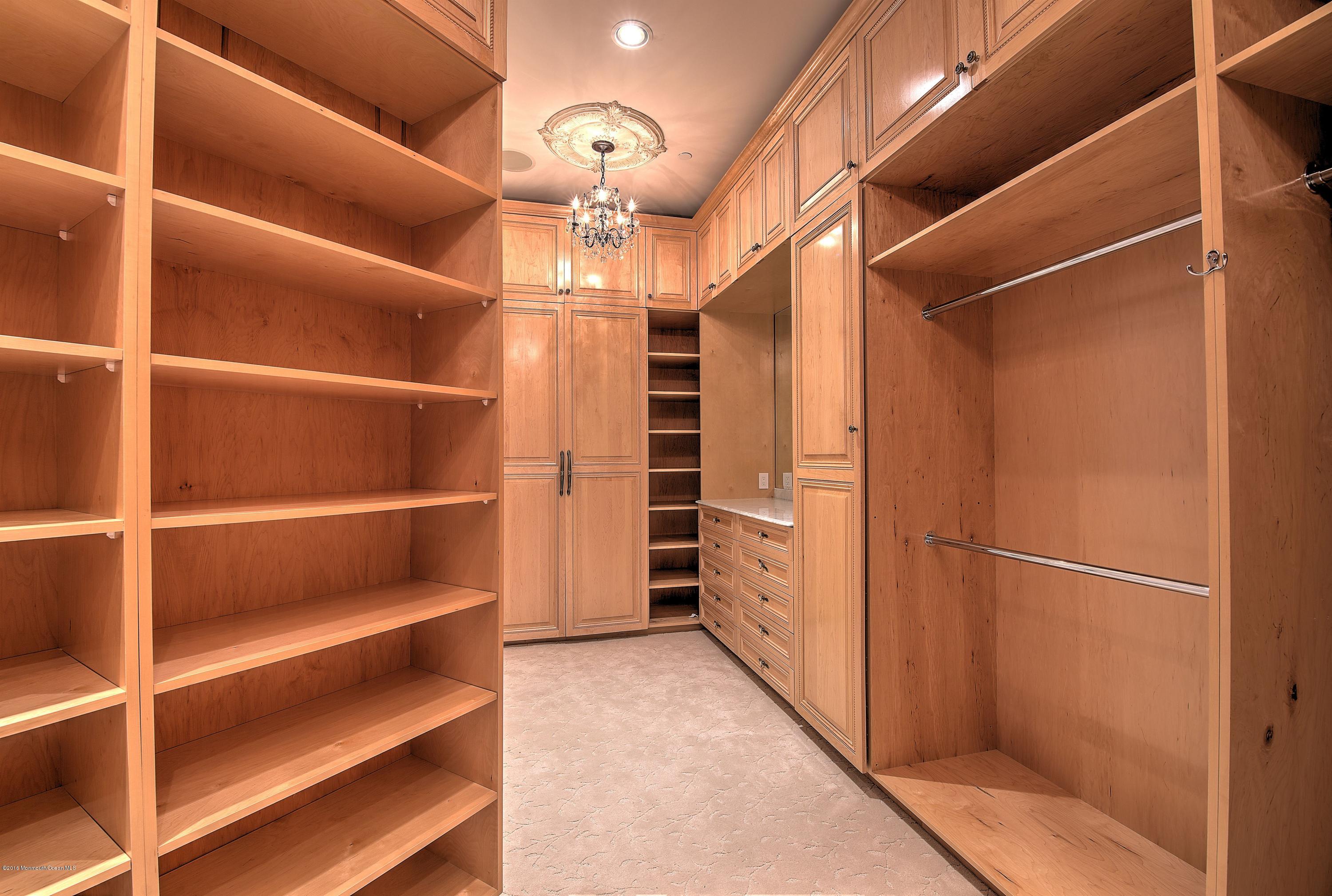 441 Oval Road Manasquan, NJ 08736 - Photo 18 of 36 a view of walk in closet with empty racks