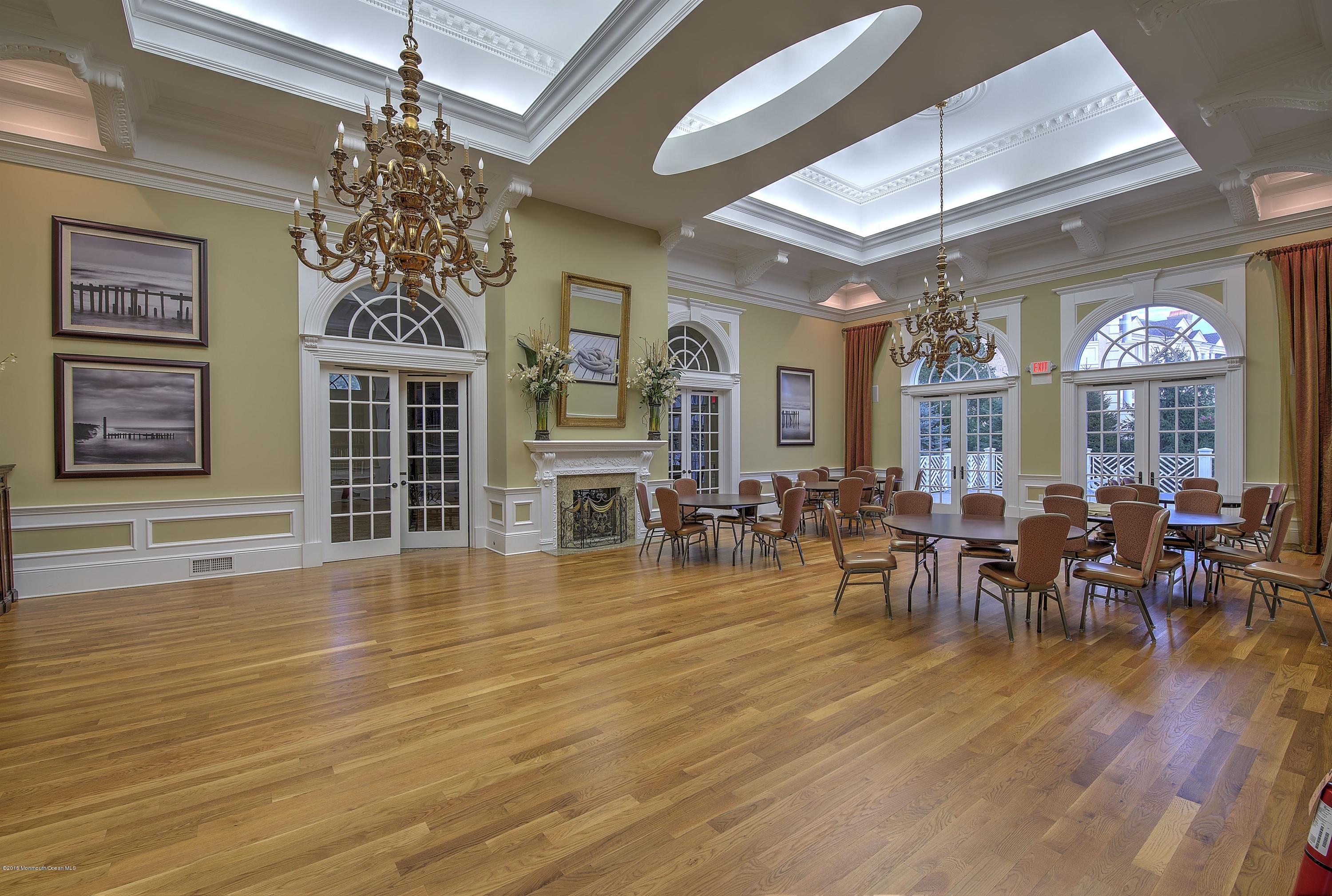 441 Oval Road Manasquan, NJ 08736 - Photo 35 of 36 a view of a dining room with furniture window and wooden floor