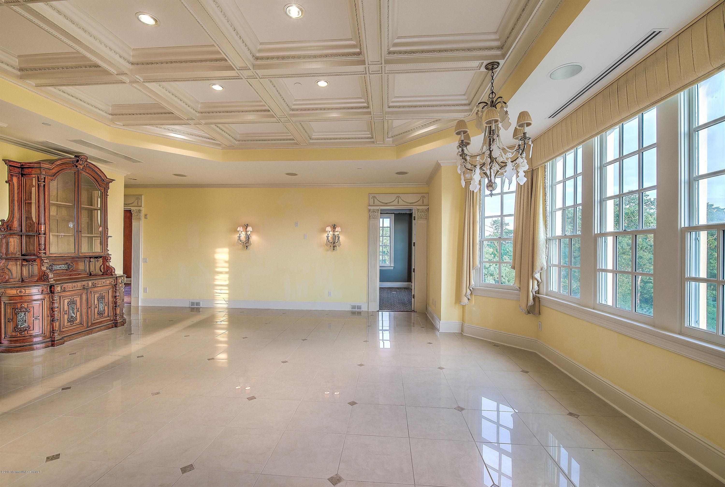 441 Oval Road Manasquan, NJ 08736 - Photo 8 of 36 a view of an empty room with a window