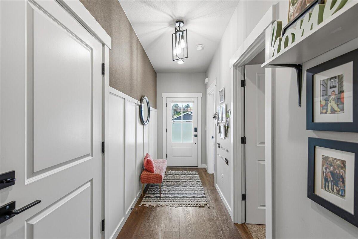 248 Christopher Way Talent, OR 97540 - Photo 21 of 33 a view of a hallway with wooden floor and staircase