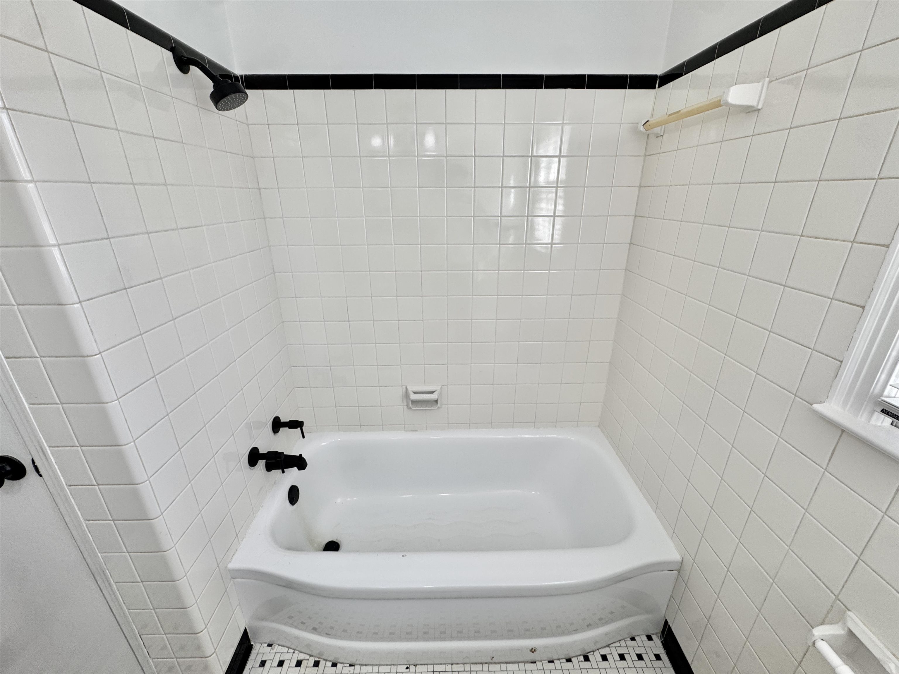 4417 Fair Meadow Road Memphis, TN 38117 - Photo 21 of 38 Bathroom featuring shower / washtub combination and tile walls