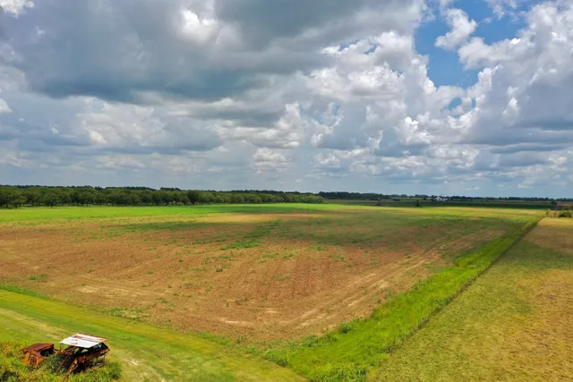 a view of yard with swimming pool and lake