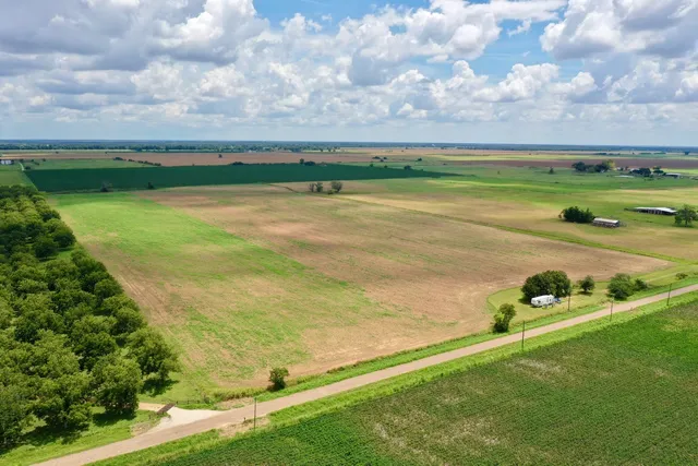 a view of a water pond with lots of green space