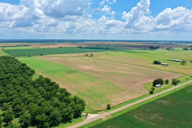 a view of a field with an outdoor space