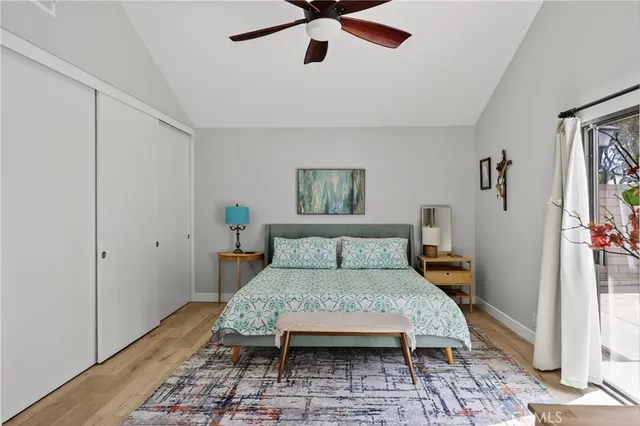 a bedroom with a bed and a view of kitchen