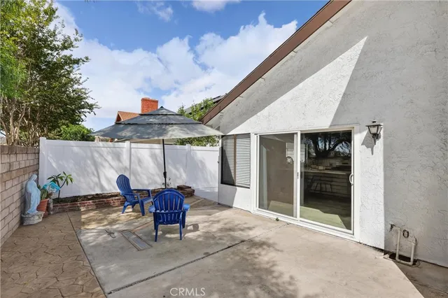 a view of a porch with potted plants