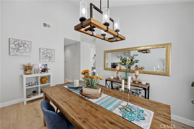 a living room with furniture and painting on the wall