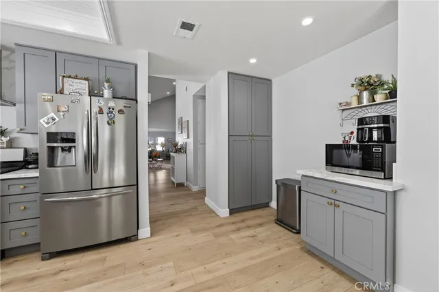 a kitchen with a sink cabinets and stainless steel appliances