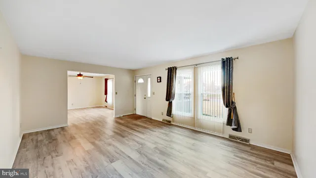 a bathroom with a sink mirror and a bathtub