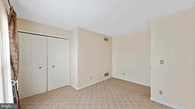 a view of an empty room and window