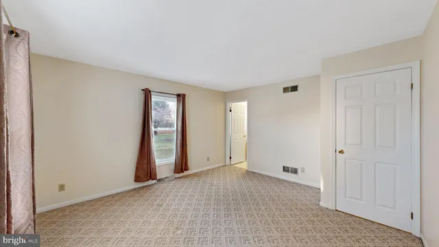 a bathroom with a toilet a sink and a mirror
