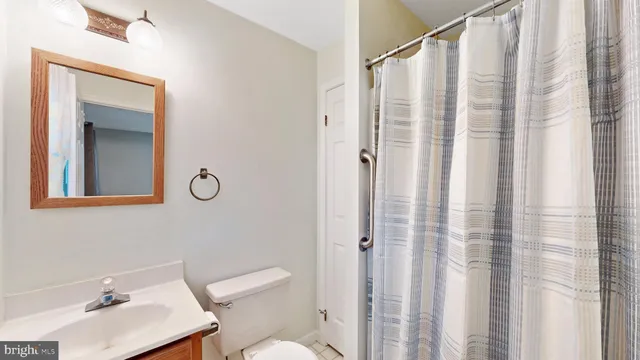 a view of living room with furniture and wooden floor