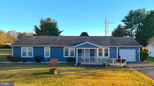 a backyard of a house with yard barbeque oven and outdoor seating