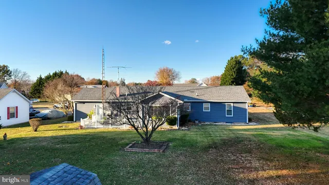 aerial view of a house with a yard