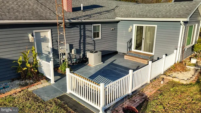 a view of front door deck and flat screen tv