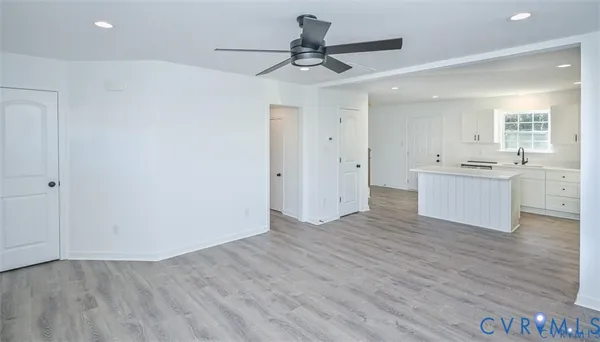 a view of a kitchen with a sink and a refrigerator
