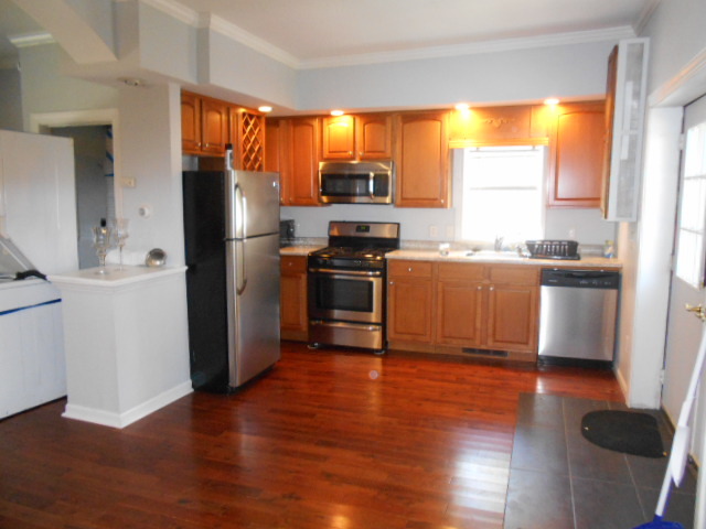 319 East Devlin Street Spring Valley, IL 61362 - Photo 16 of 19 a kitchen with stainless steel appliances granite countertop a refrigerator a sink a stove a microwave and wooden floor