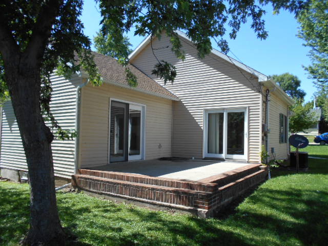 319 East Devlin Street Spring Valley, IL 61362 - Photo 17 of 19 a view of a house with a small deck and a large tree