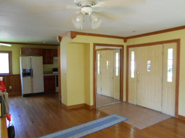 319 East Devlin Street Spring Valley, IL 61362 - Photo 6 of 19 a view of livingroom with hardwood floor and a ceiling fan