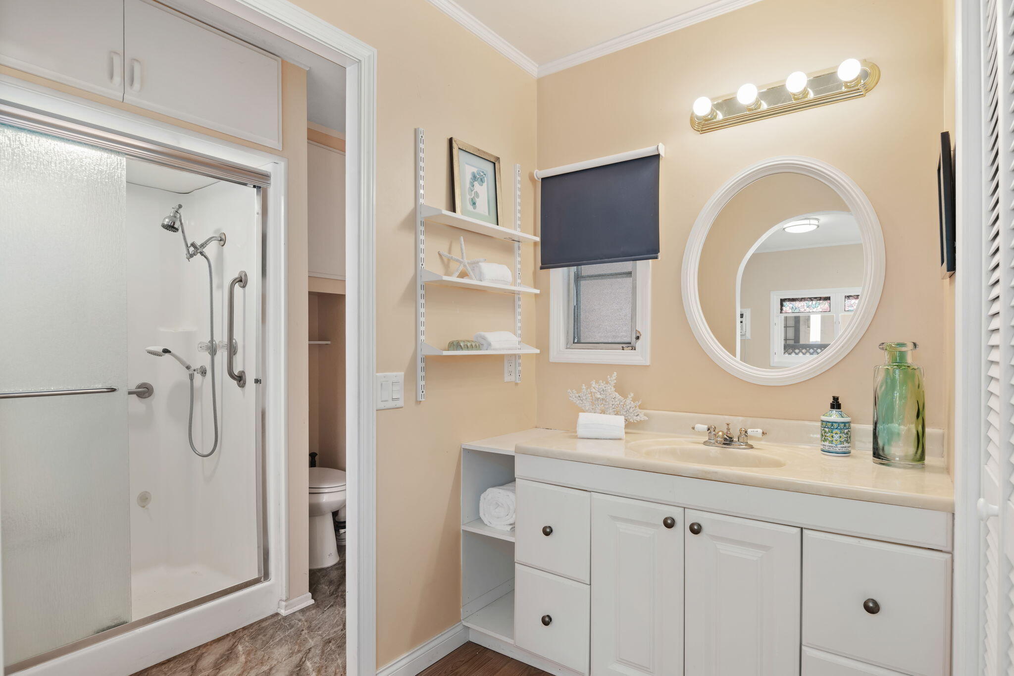 333 Old Mill Road, Unit 258 Santa Barbara, CA 93110 - Photo 11 of 20 a bathroom with a double vanity sink mirror and shower