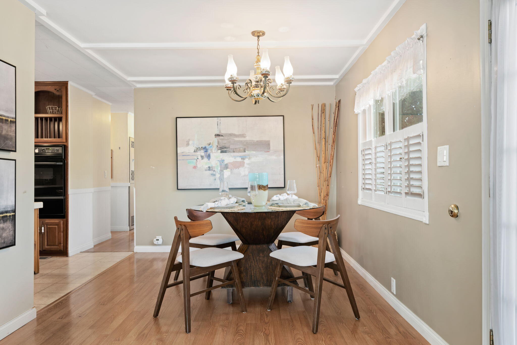333 Old Mill Road, Unit 258 Santa Barbara, CA 93110 - Photo 7 of 20 a view of a dining room with furniture a chandelier and wooden floor