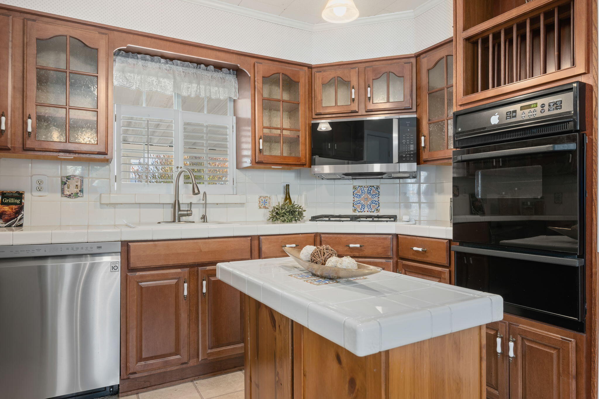 333 Old Mill Road, Unit 258 Santa Barbara, CA 93110 - Photo 9 of 20 a kitchen with stainless steel appliances granite countertop a sink stove and microwave
