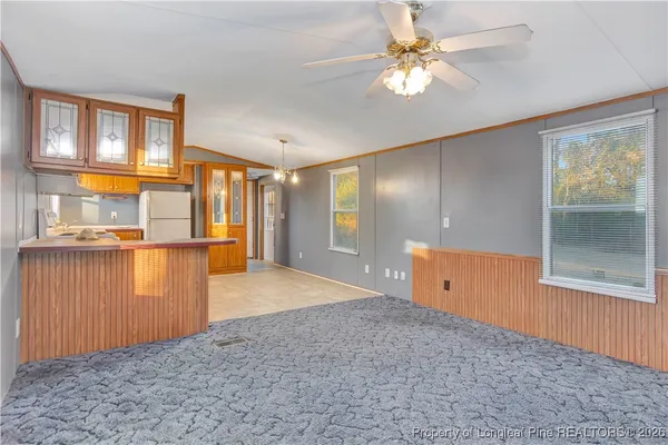 a view of a kitchen with a cabinet and a window
