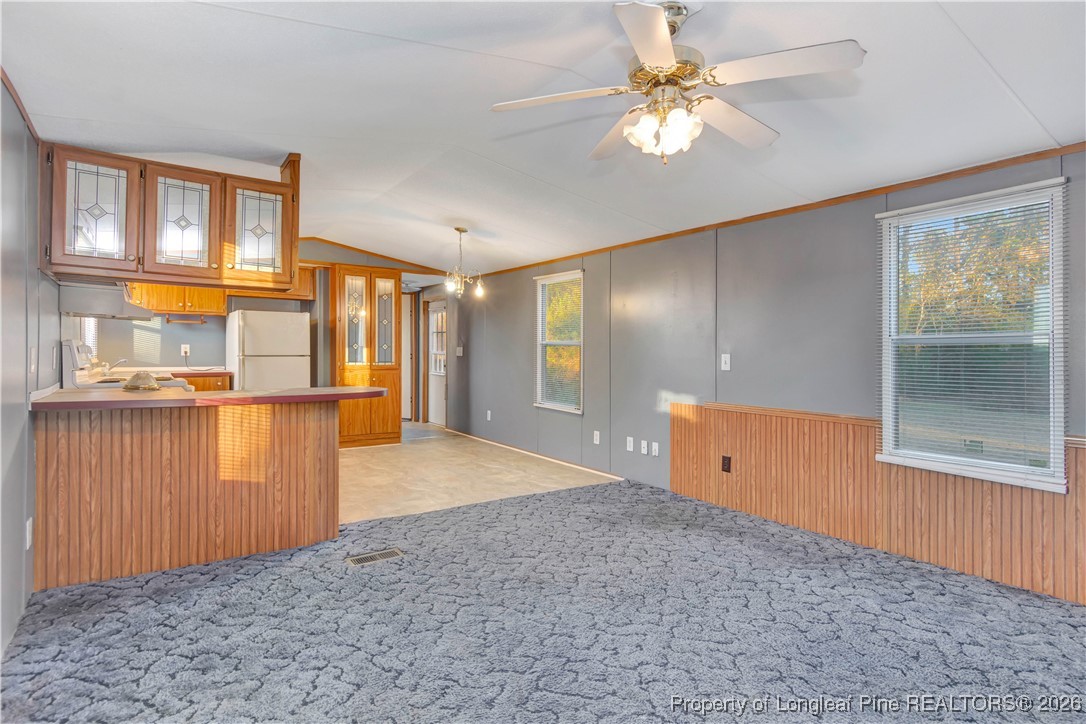 6461 Wire Grass Road Orrum, NC 28369 - Photo 4 of 22 a view of a kitchen with a cabinet and a window