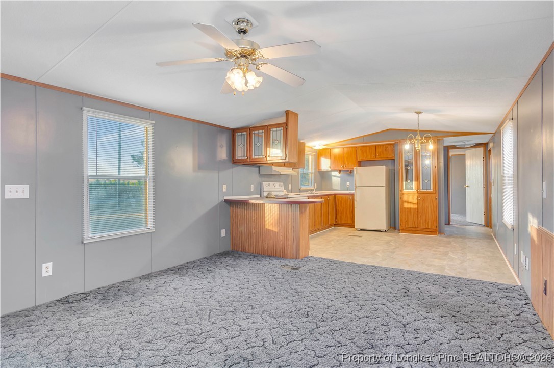 6461 Wire Grass Road Orrum, NC 28369 - Photo 6 of 22 a view of an empty room with a window