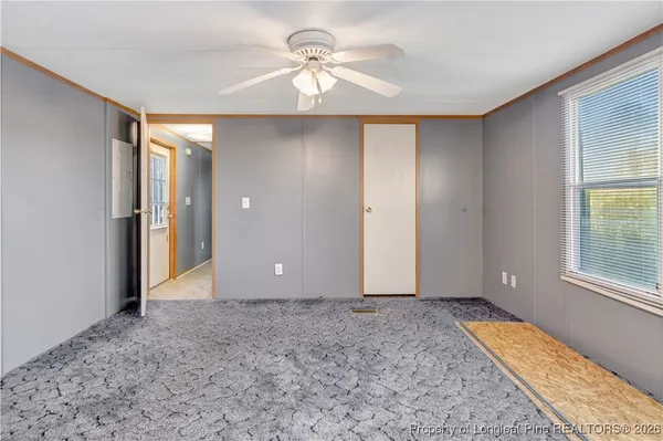 a view of an empty room with windows
