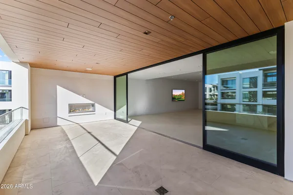 a view of a porch with a floor to ceiling window