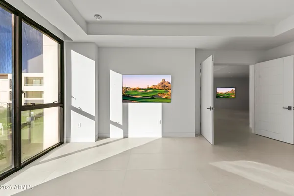 a view of an empty room with a sliding door