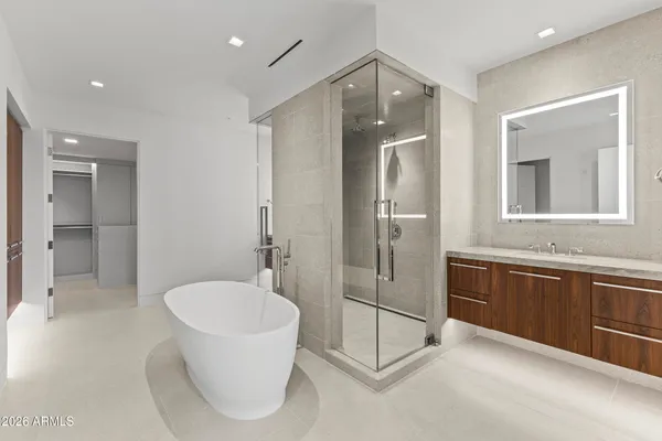 a view of hallway with wooden floor and windows