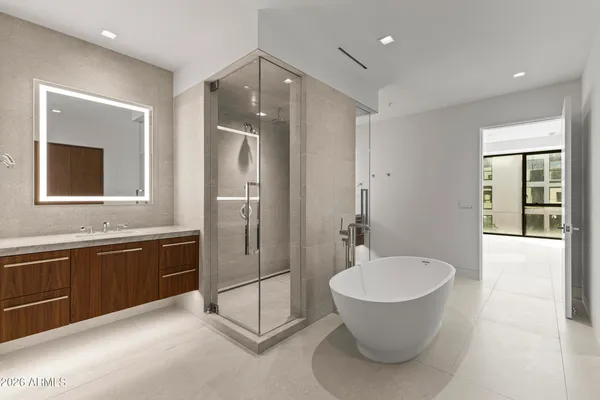 a bathroom with a bathtub and a sink