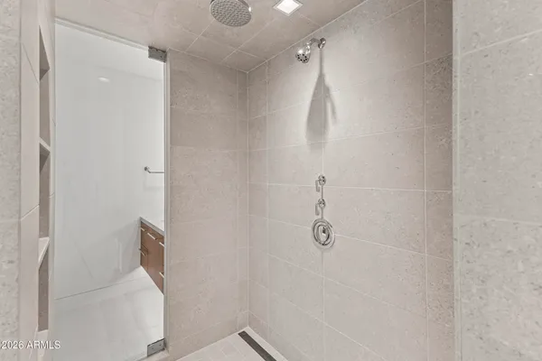 a bathroom with a tub sink and mirror