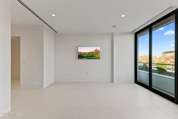 a view of an empty room with a window