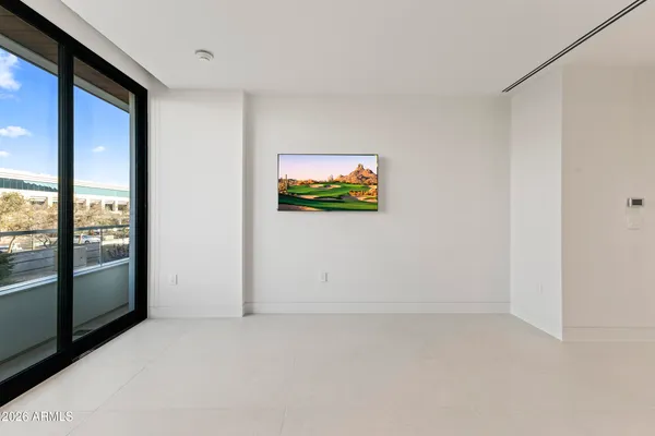 a spacious bathroom with a toilet sink and shower