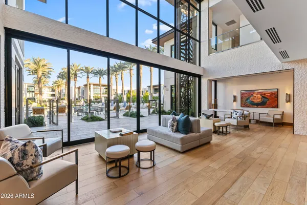 a dining room with furniture and wooden floor