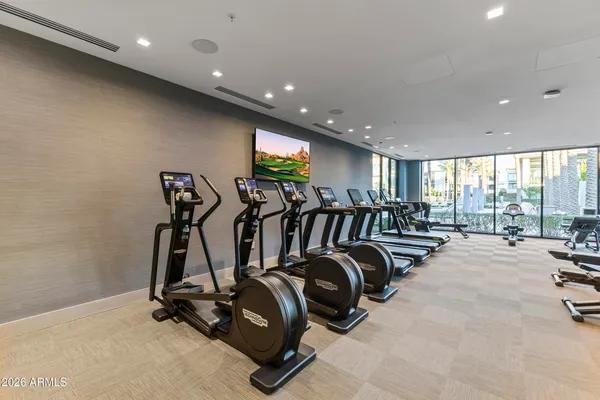 a lobby with furniture and floor to ceiling window