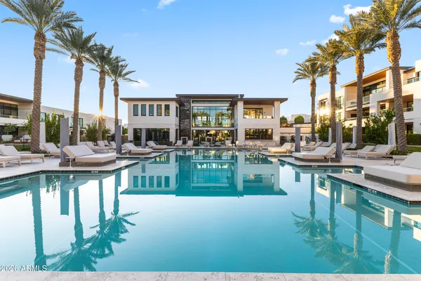 a view of an empty room with glass door and furniture