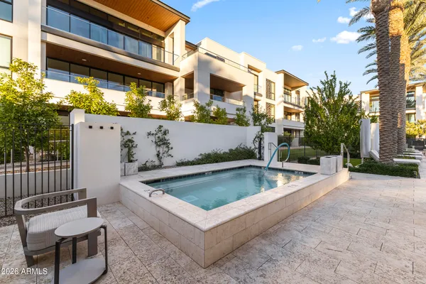 a view of outdoor space with swimming pool and furniture