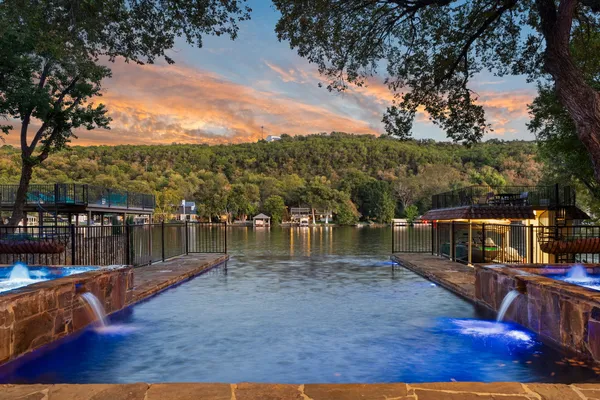 a view of a swimming pool with a patio