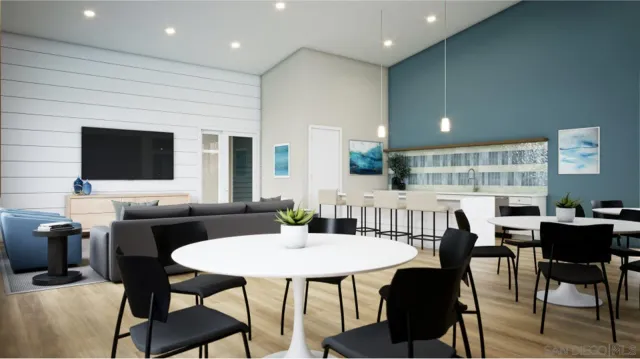 a kitchen with a table and chairs in it