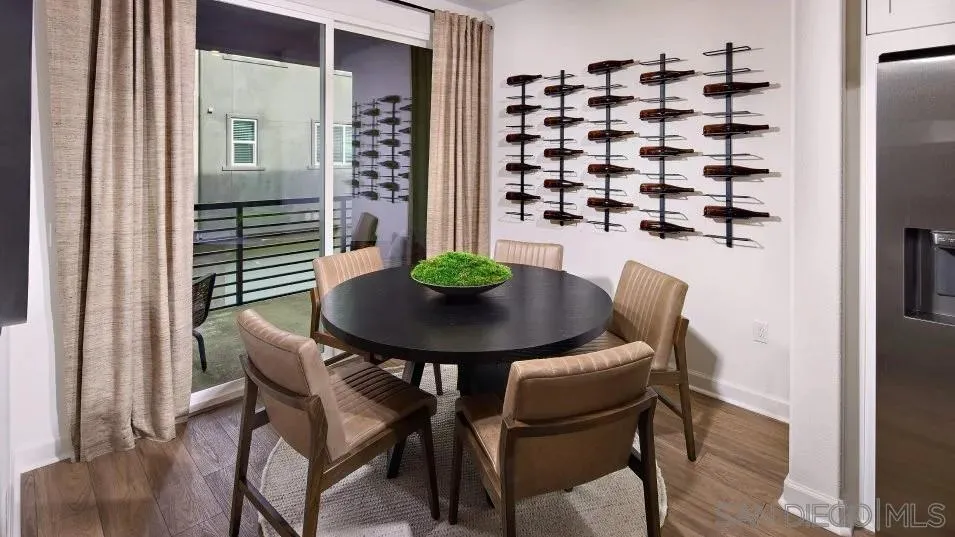 857 Cheyne Loop, Unit 3 Chula Vista, CA 91911 - Photo 5 of 16 a view of a dining room with furniture and wooden floor