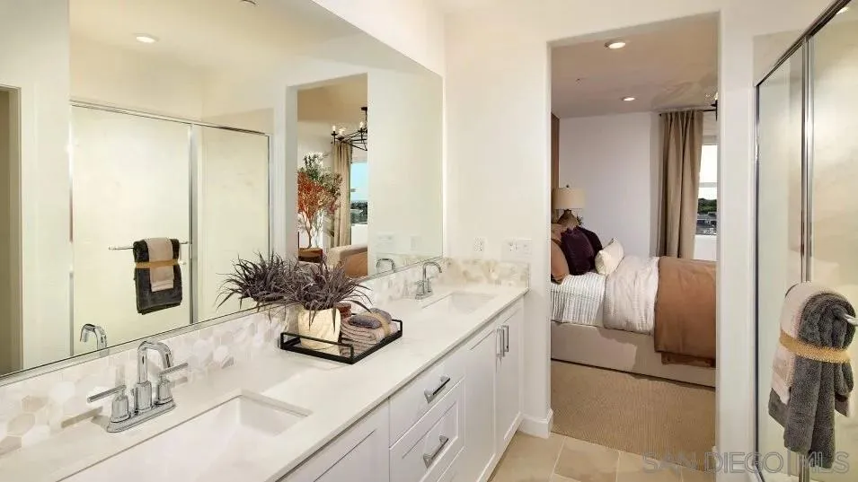 857 Cheyne Loop, Unit 3 Chula Vista, CA 91911 - Photo 9 of 16 a bathroom with a double vanity sink and mirror
